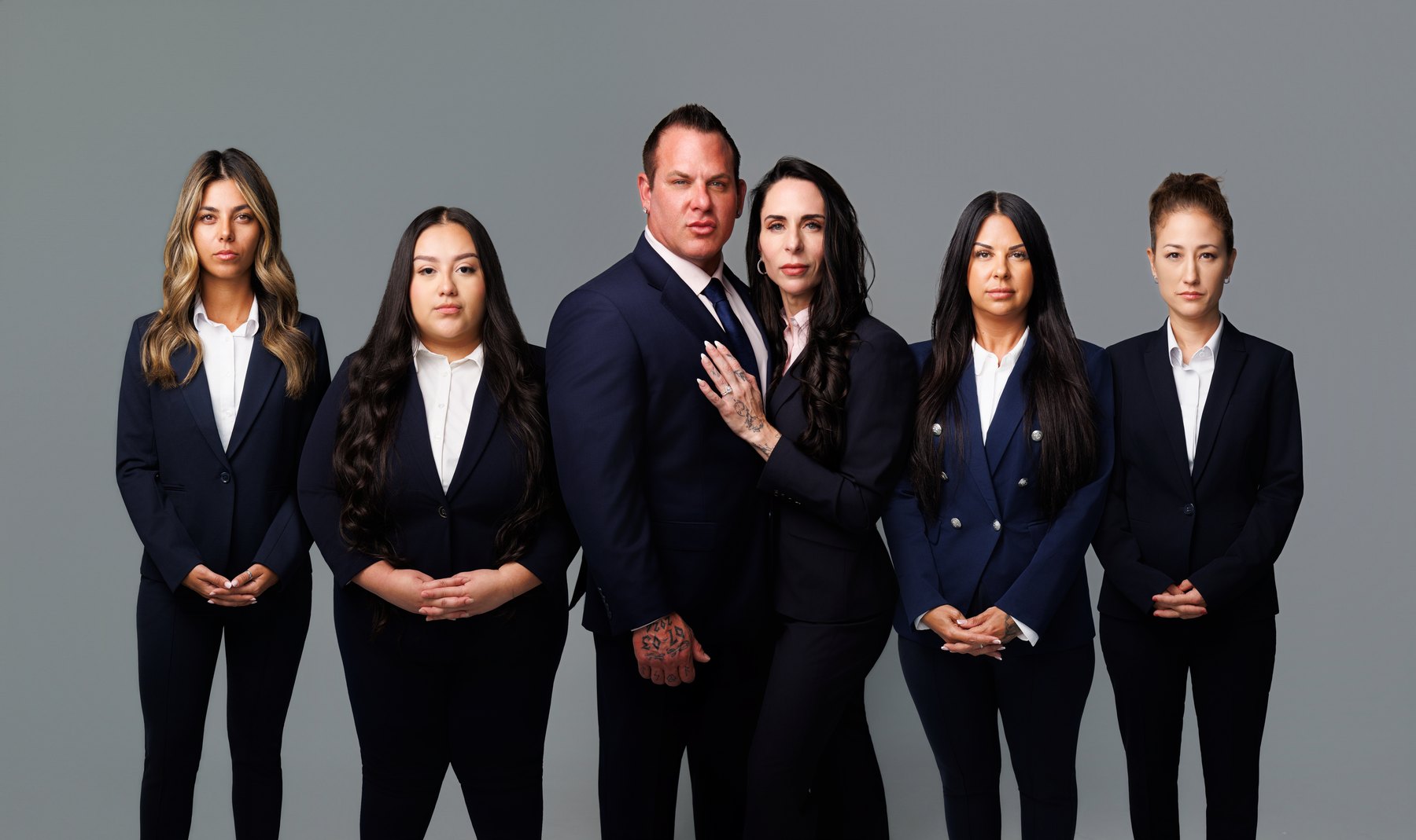 A full team photographed in consistent studio light
